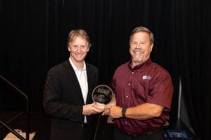 Miles Moreau receives the 2023 CIRCUITS ASSEMBLY Service Excellence Award on behalf of KIC Thermal
